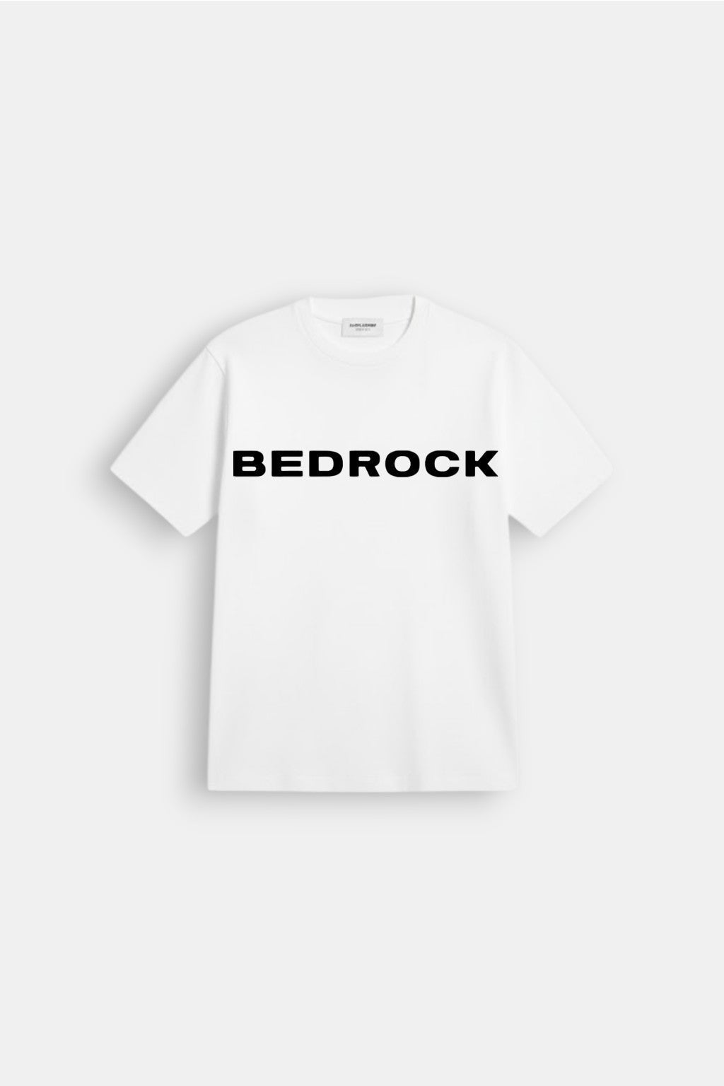 Bedrock T Shirt - white t-shirt with bold Bedrock wordmark graphic, front view