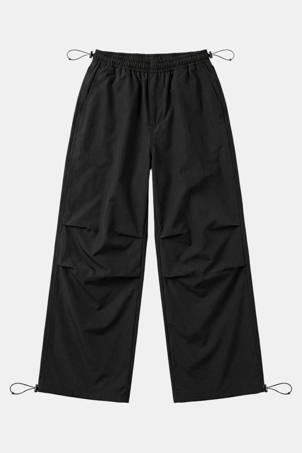Black Parachute Pants - black parachute style pants with drawcord ankle cuffs, front view