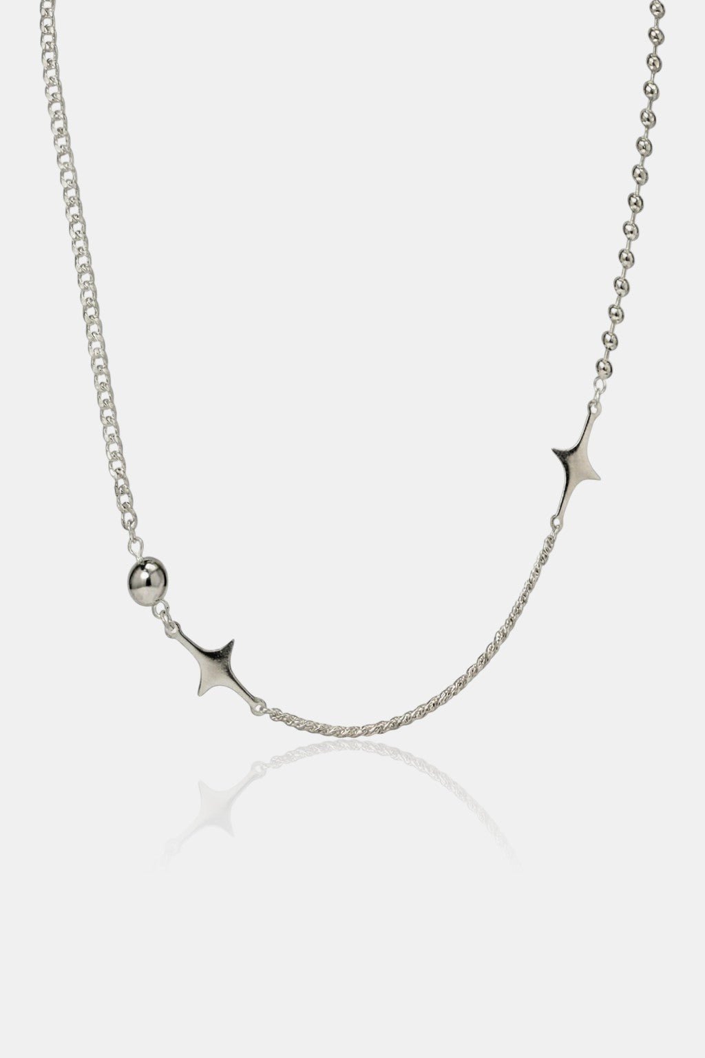 Cyber Y2K Necklace - curved asymmetric chain with star charms, front view