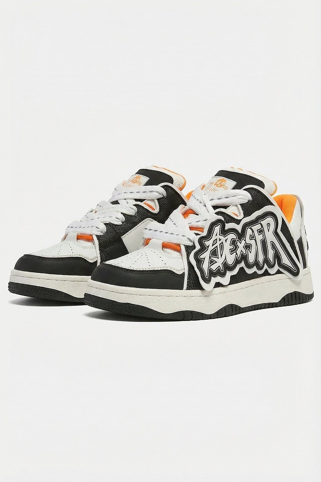 Graffiti Sneakers - black and white sneakers with graffiti tag graphic patch, front view