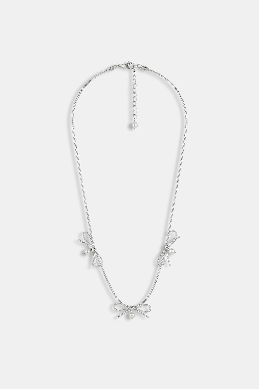 Knot Choker - silver choker with repeating bow charm detail, front view