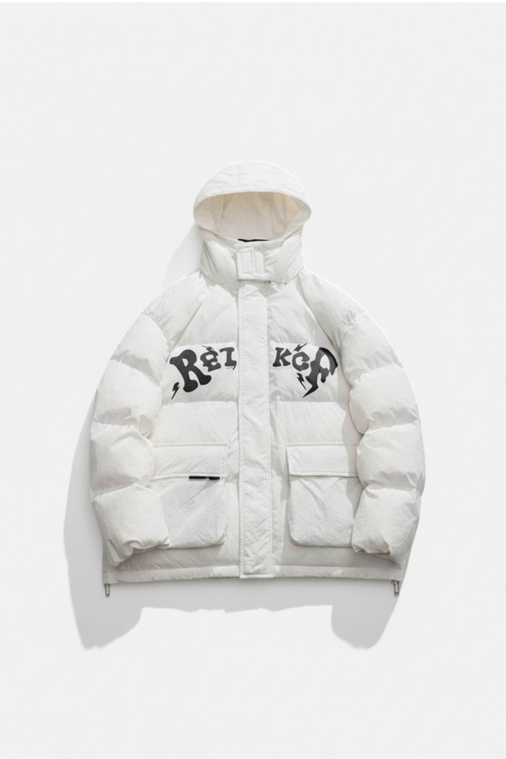 Puffer Jacket Drill UK - off-white cropped puffer with graffiti lettering and cargo pocket, front view