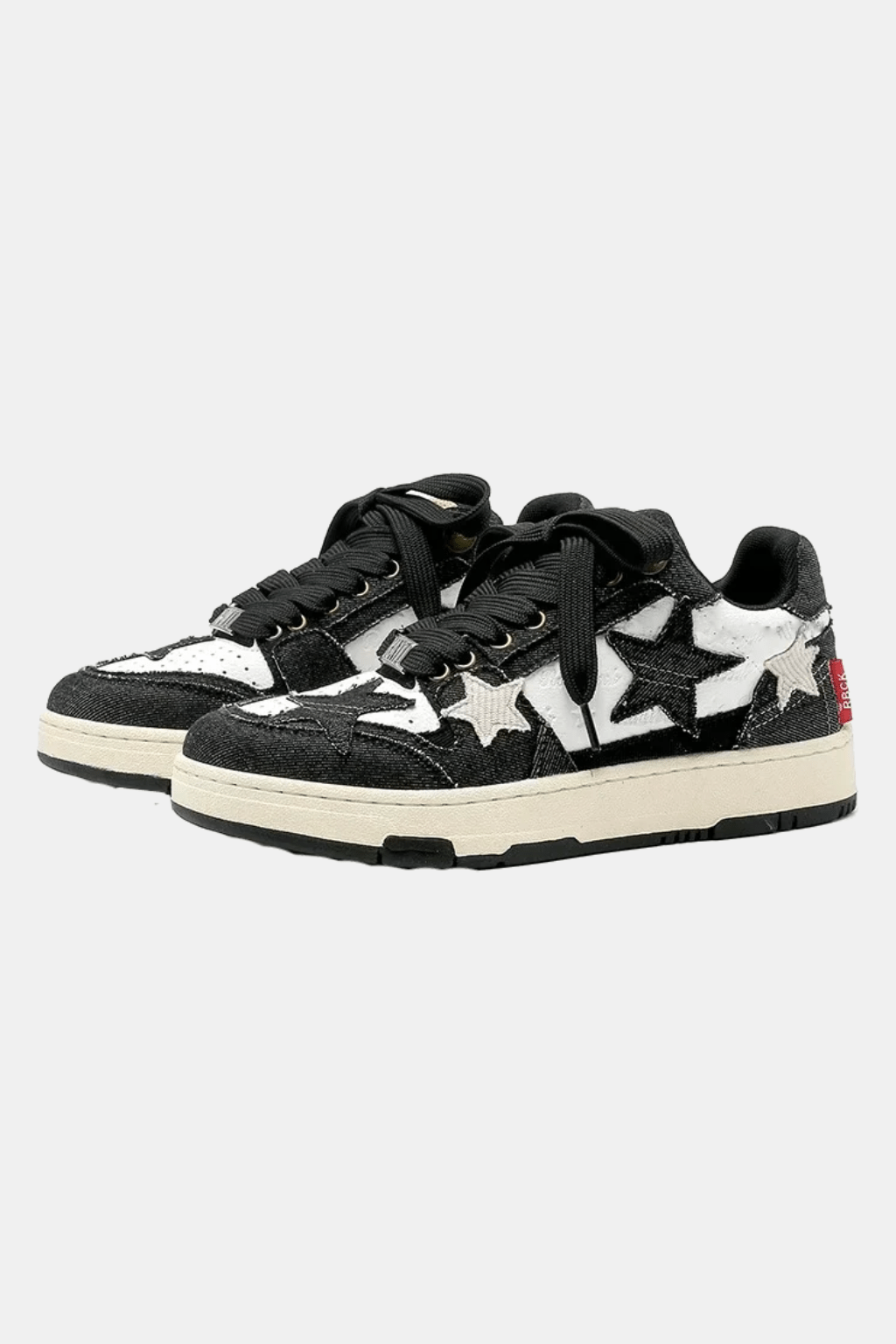 Star Sneakers - black and white low top sneakers with star patches, front view